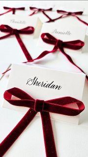 Black ink on crisp white place cards, each tied with a red velvet ribbon.

A classic, understated detail that quietly elevates an intimate private Christmas party. Thoughtful, festive, and timeless 🎄✨

Floryntina
Perth Calligrapher | Perth Engraver | Perth Bottle Painter | On site Events
.
.
.
.
#calligraphy #livecalligraphy #engraving #hotfoilingdesign #bottlepainting #productpersonalisation #productpainting #perthcreatives #perthsmallbusiness #madeinperth #brandactivations #eventelevation #eventactivationperth #perthevents #eventsinperth #eventmanagerperth #eventorganiserperth #marketingperth #brandexperience #luxurybrandactivation #experientialmarketing #customerexperience #influencerevents #corporateeventsperth #luxuryeventsperth #perthbrands #perthmarketing #eventstylingperth #customisedexperience